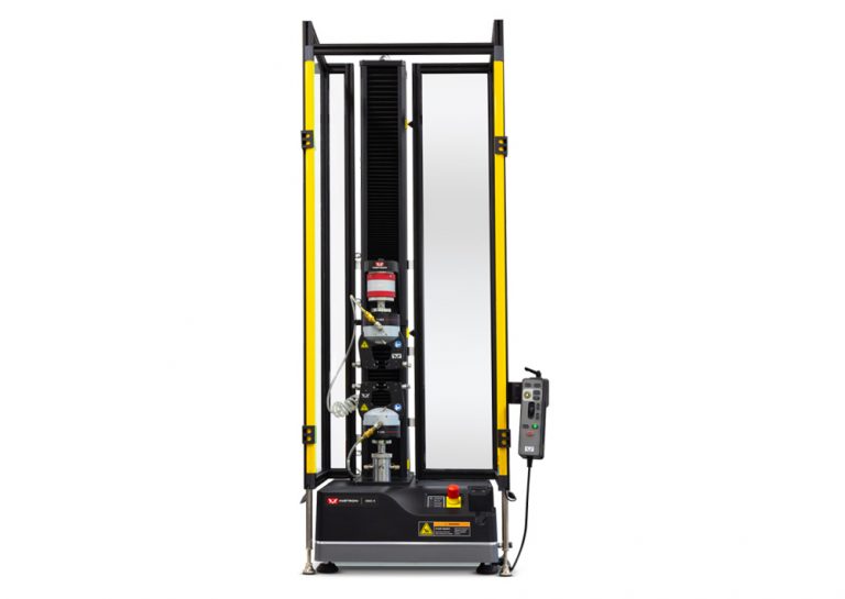 Full front view of an Instron 68SC universal testing machine enclosed within a black and yellow safety light curtain, pneumatic side-action grips mounted on the load frame, and an ergonomic handset on the right side.